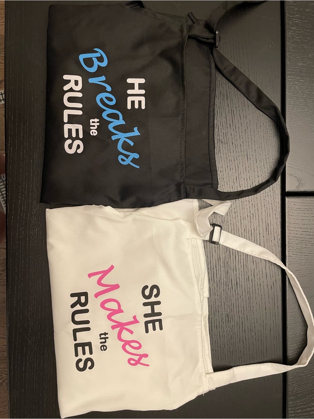 Black and White 'He Breaks the Rules / She Makes the Rules' Graphic aprons